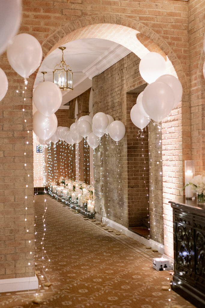 Pine Hollow Country Club wedding reception balloon-lined hallway. 