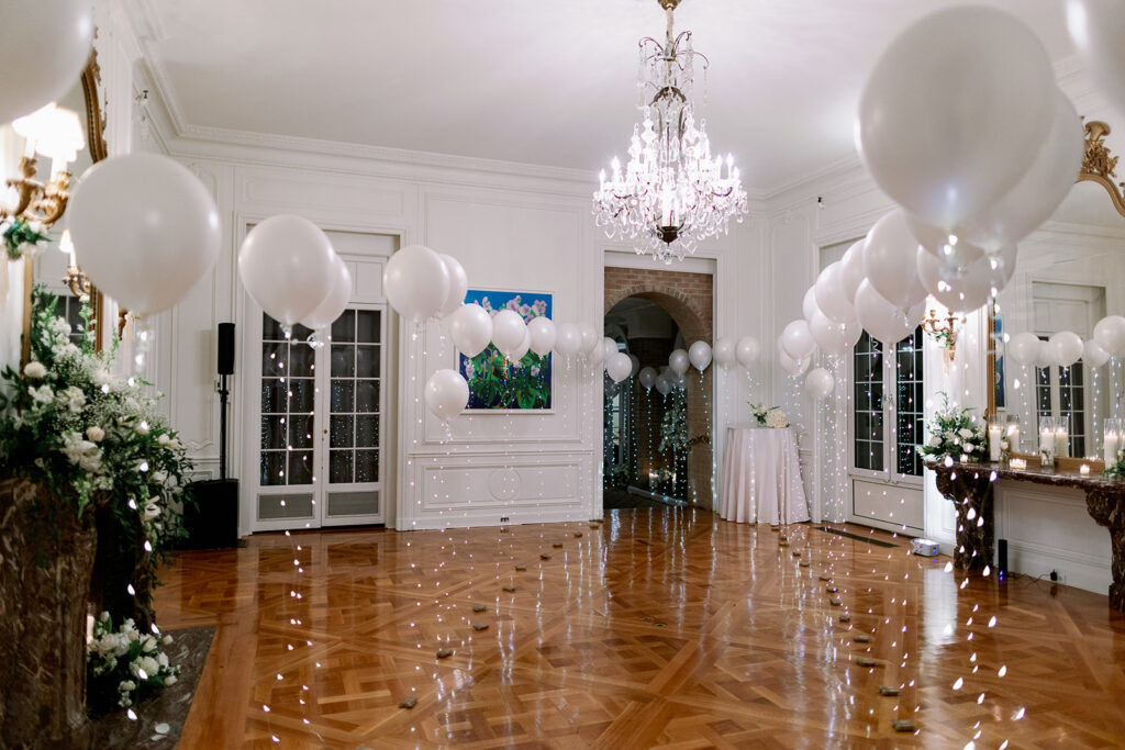 Pine Hollow Country Club ballroom decorated with balloons and candles for a wedding dance party. 