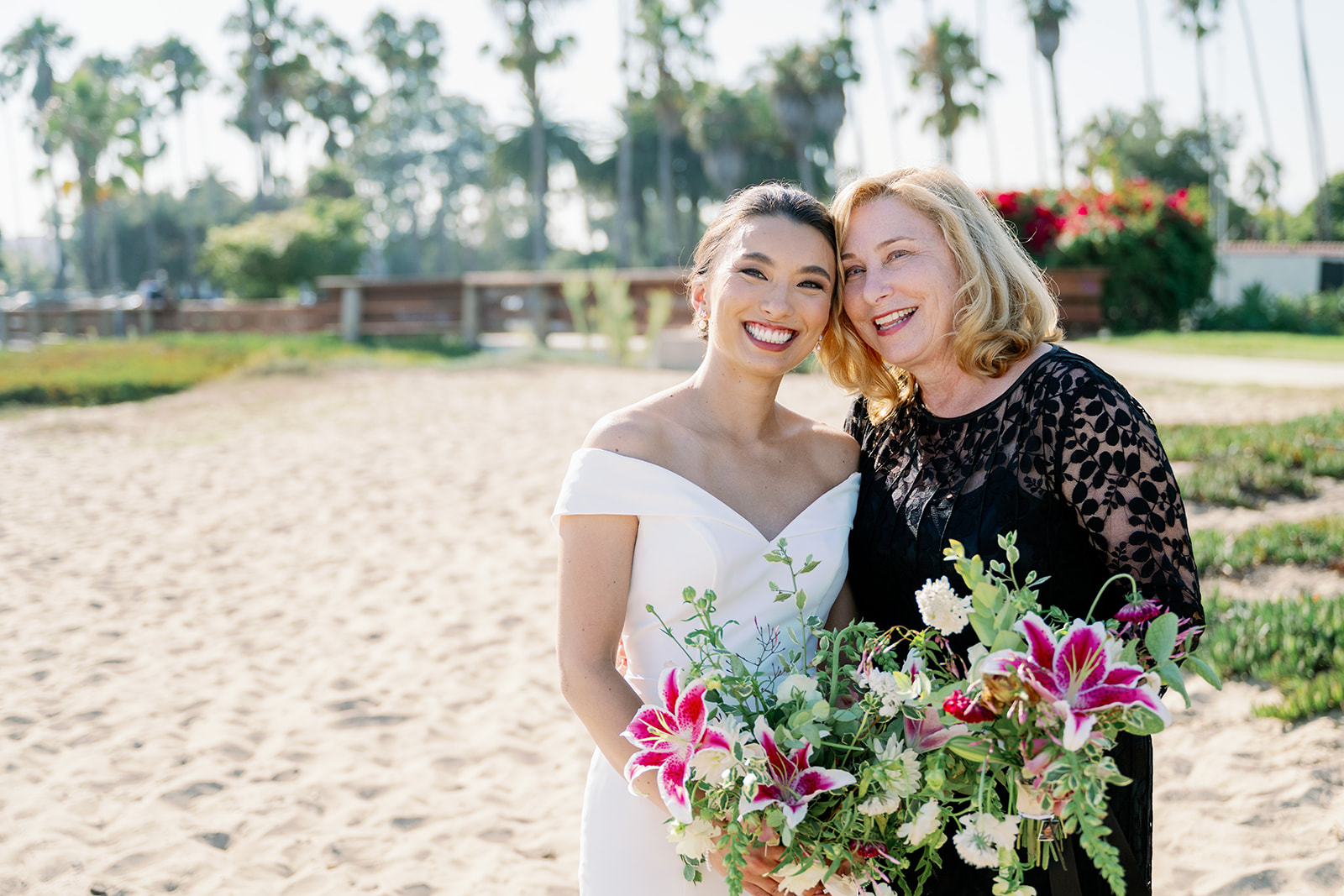 Bride and her mom posing on the beach in Santa Barbara. 