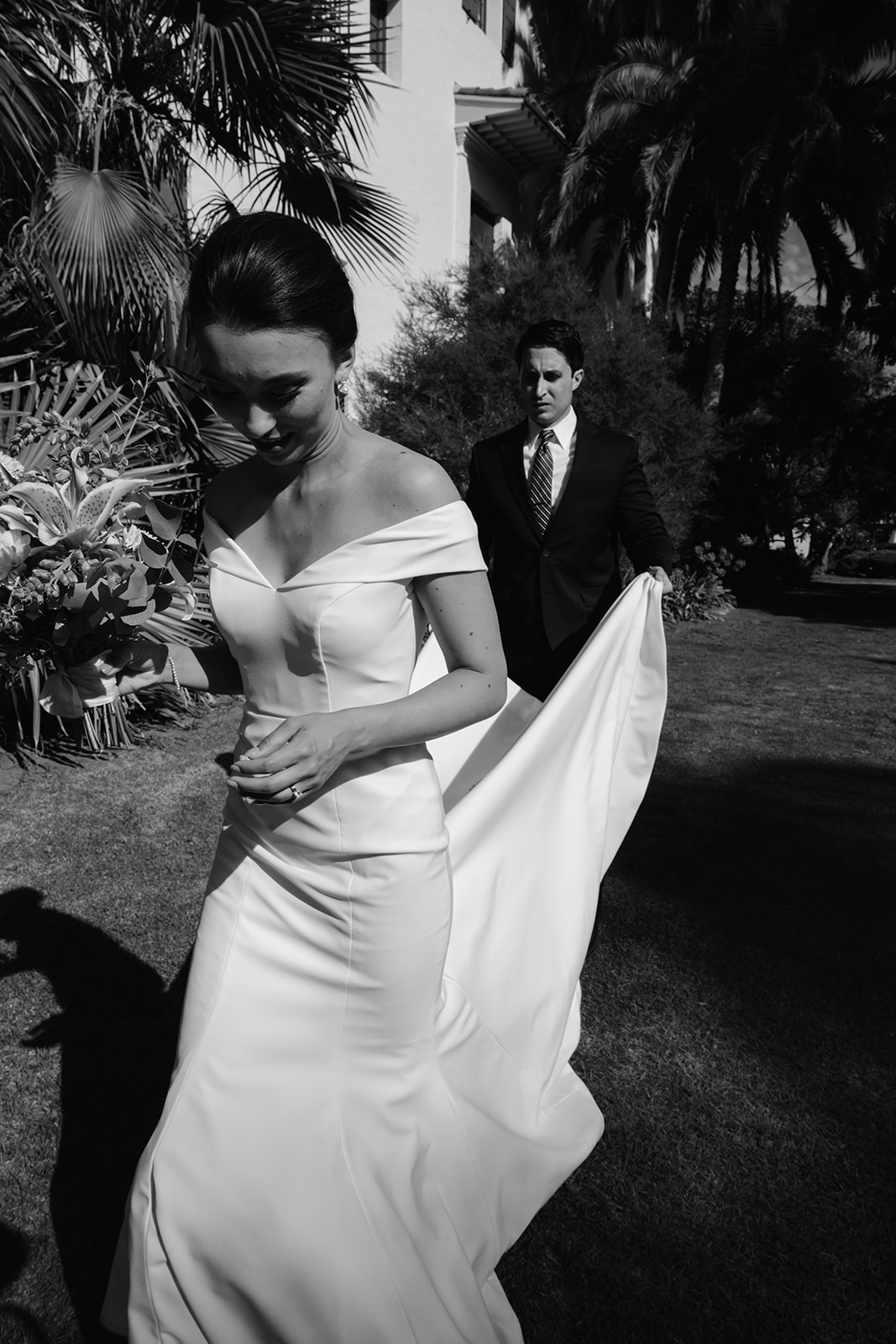 Bride and groom walking outside the Santa Barbara Courthouse. 