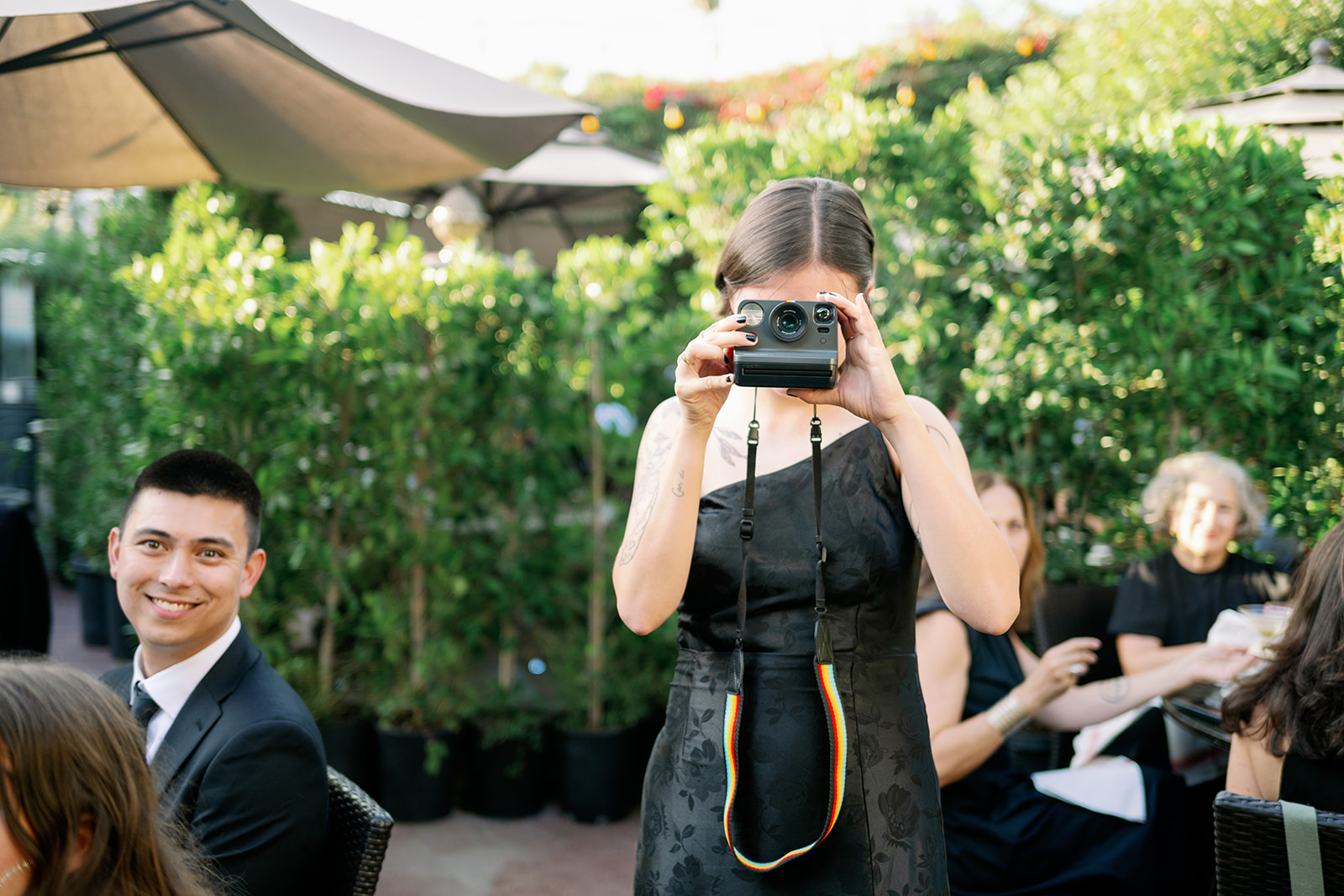 Wedding guest taking a polaroid. 
