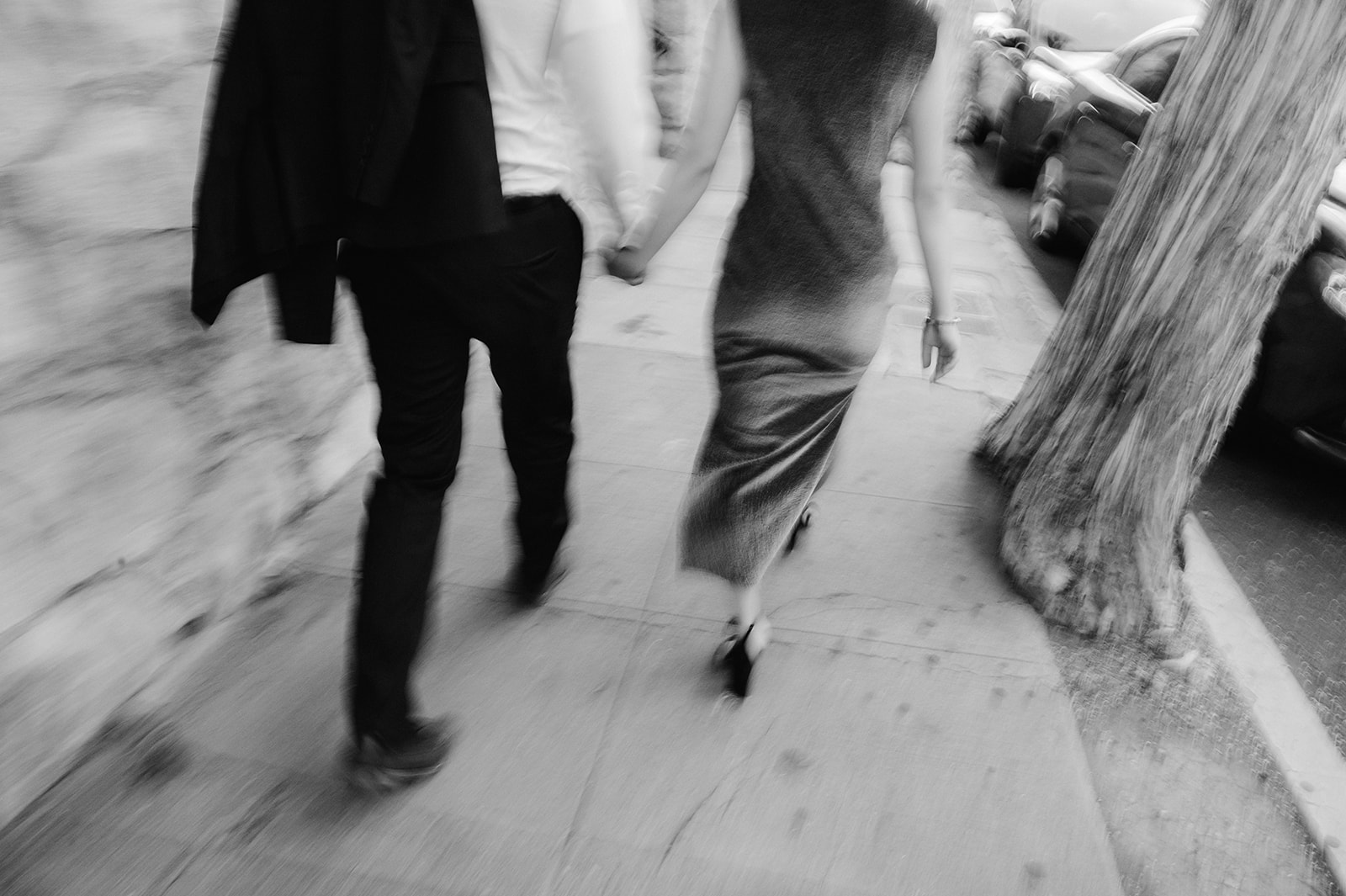 Motion blur couple walking in downtown Santa Barbara. 