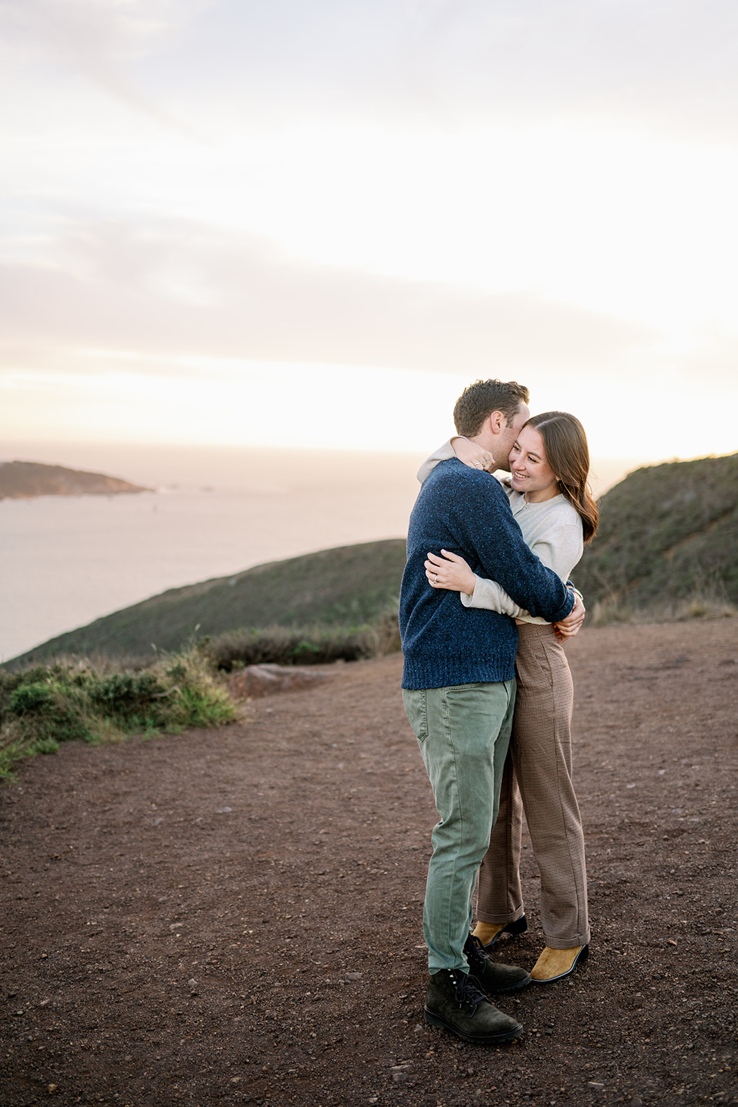 Romantic and candid engagement photo at Marin Headlands in San Francisco. 