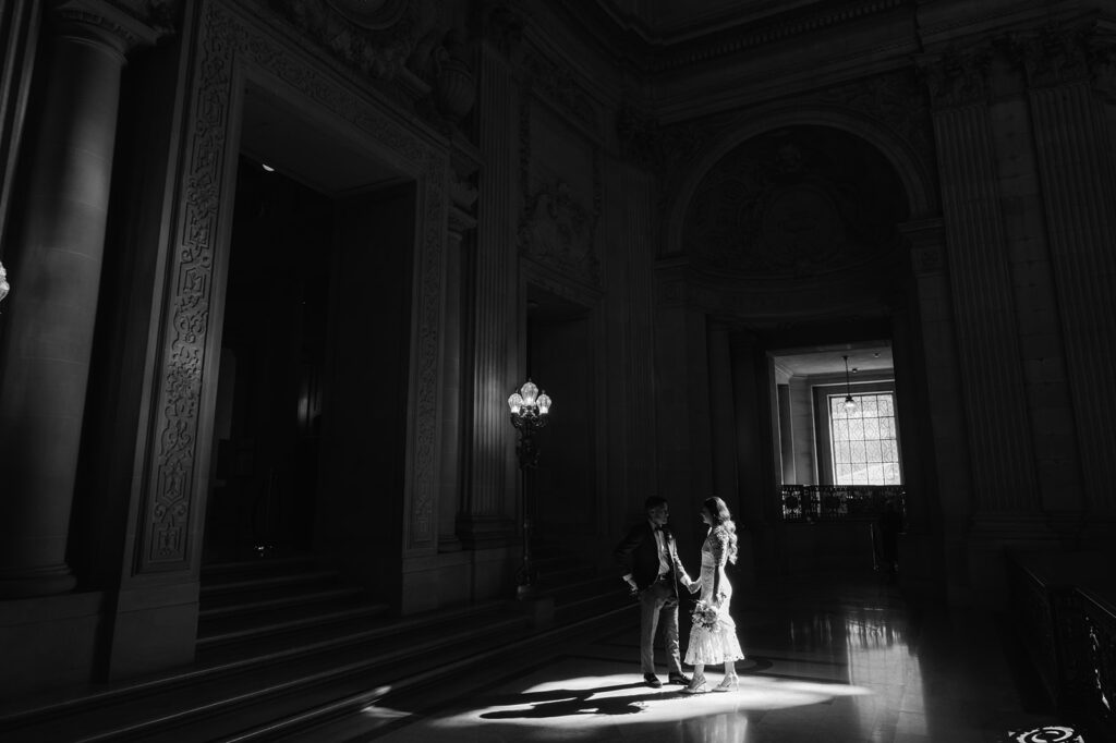 Candid SF City Hall bride and groom portrait. 