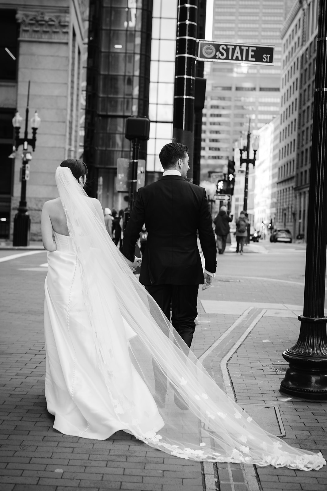 Bride and groom portrait on State Street in Boston. 
