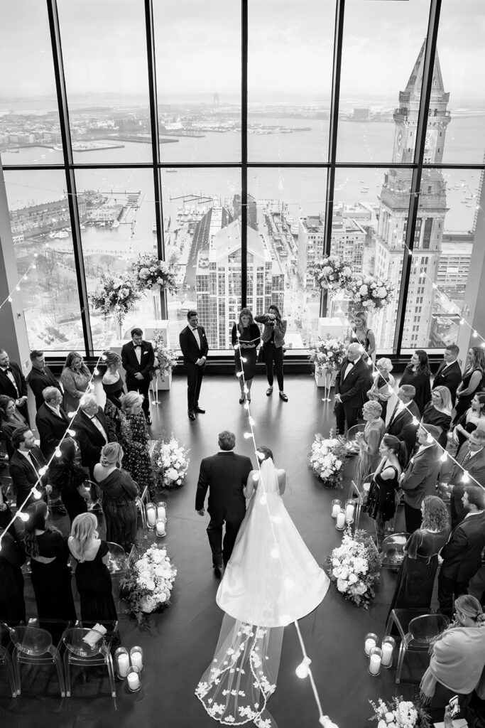 Birds-eye view of a bride walking down the aisle at a Boston State Room wedding.