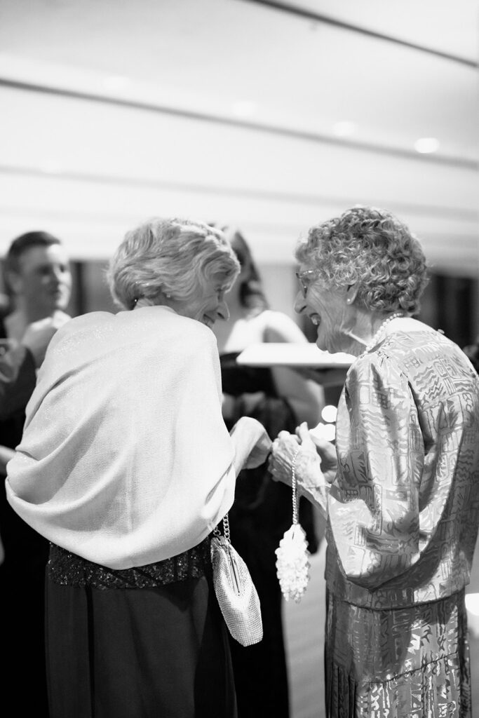 Boston State Room wedding cocktail hour candid guest photo of two elderly women.