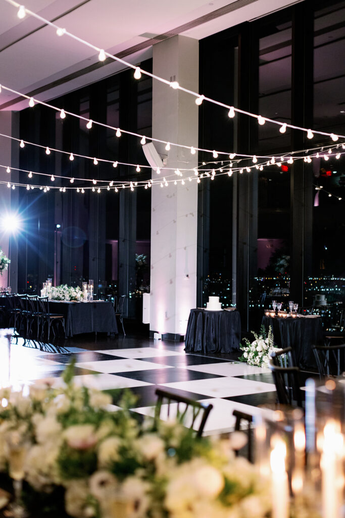 Boston State Room wedding reception with a checkered dance floor. 