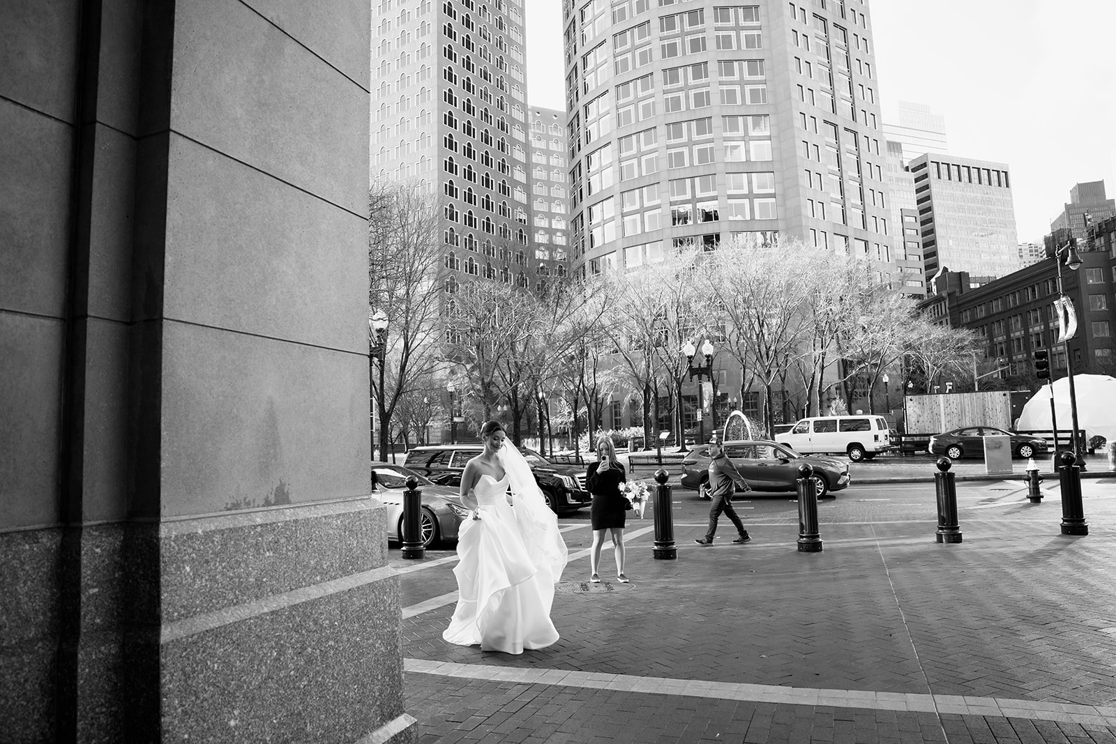Bride toward the groom under the arch at the Boston Harbor Hotel. 