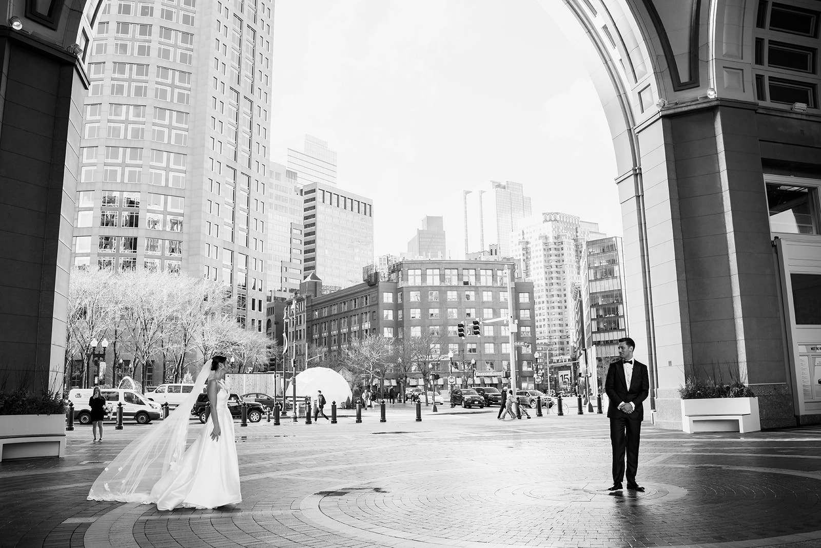Bride and groom first look under the archway at Rowes Wharf. 