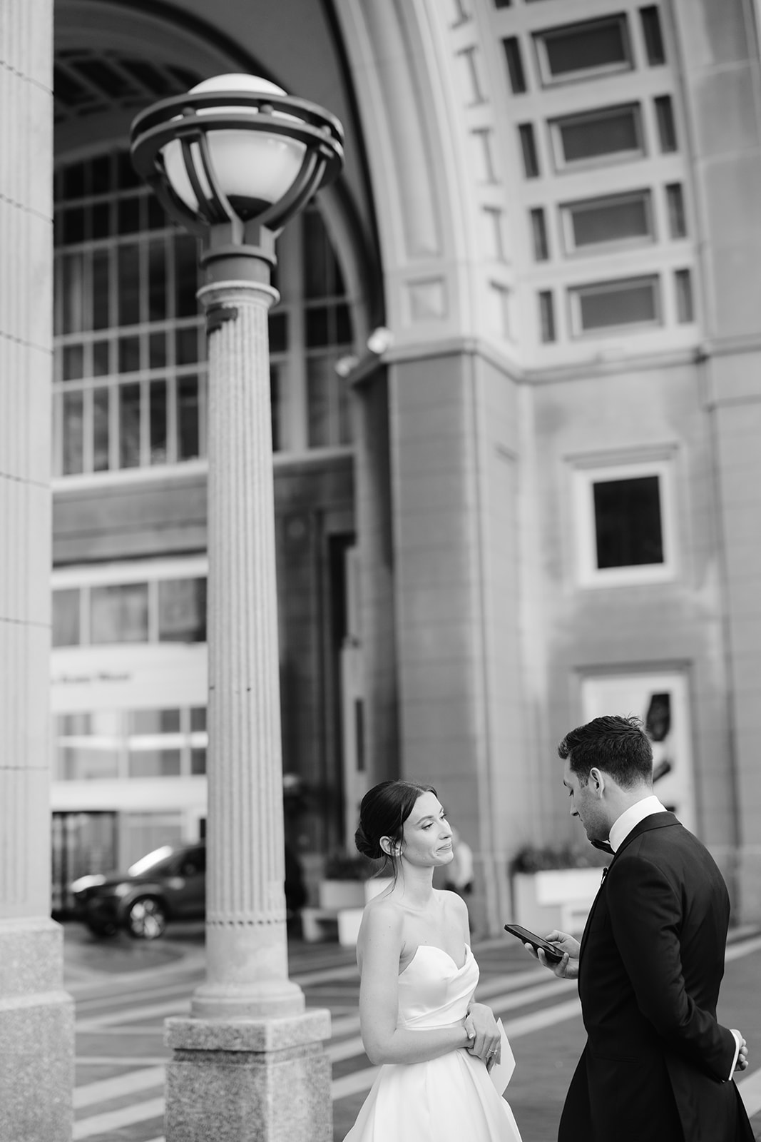 Groom reading his vows to the bride outside the Boston Harbor Hotel. 