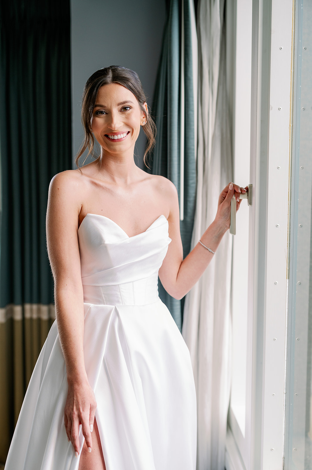 Editorial bridal portrait next to a well lit window at the Boston Harbor Hotel. 
