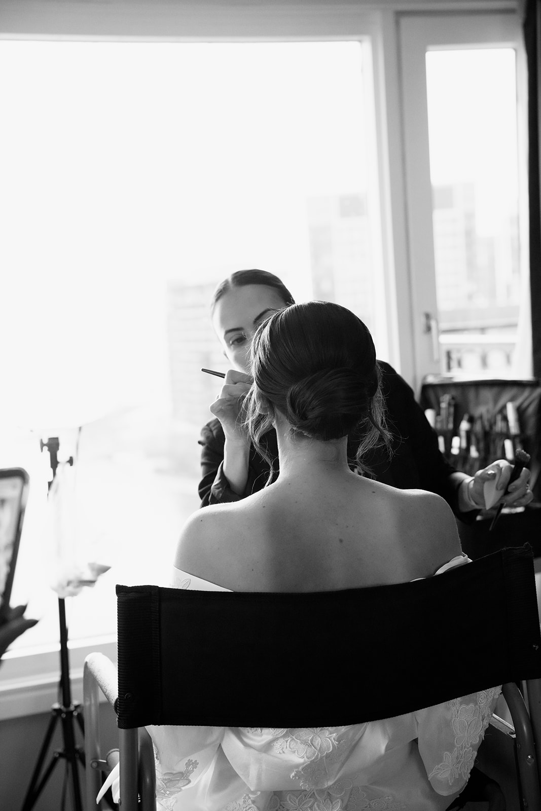 Bride getting her makeup done for her Boston wedding at the State Room. 