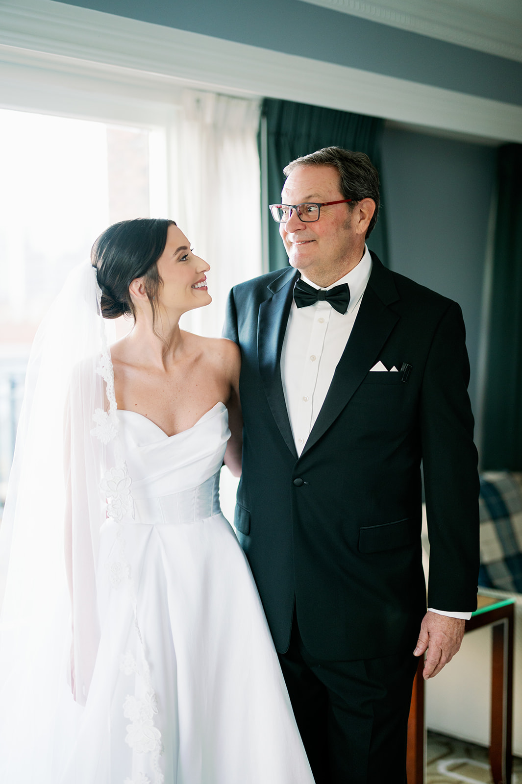 Bride and dad portrait after their first look at the Boston Harbor Hotel. 