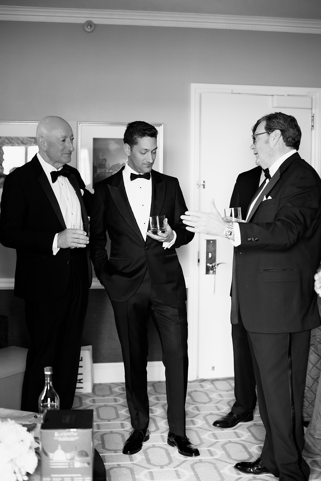Groom and the guys sharing a drink after getting ready at the Boston Harbor Hotel. 