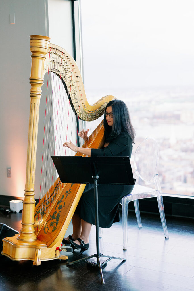 Professional harpist playing at the Boston State Room for a wedding ceremony.