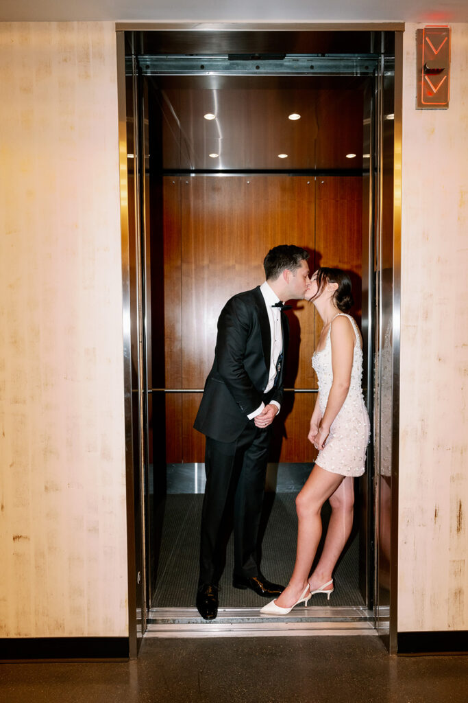 Bride and groom elevator photos at 60 State Street. 