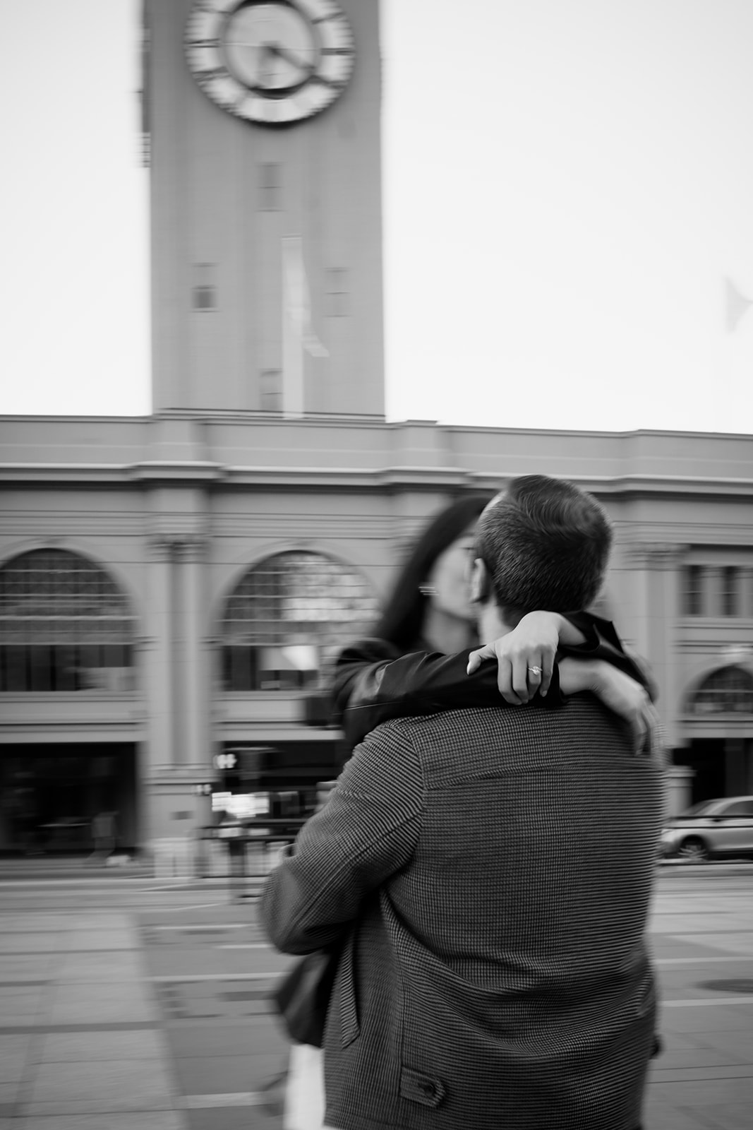 Motion blur engagement photos outside the San Francisco ferry building.