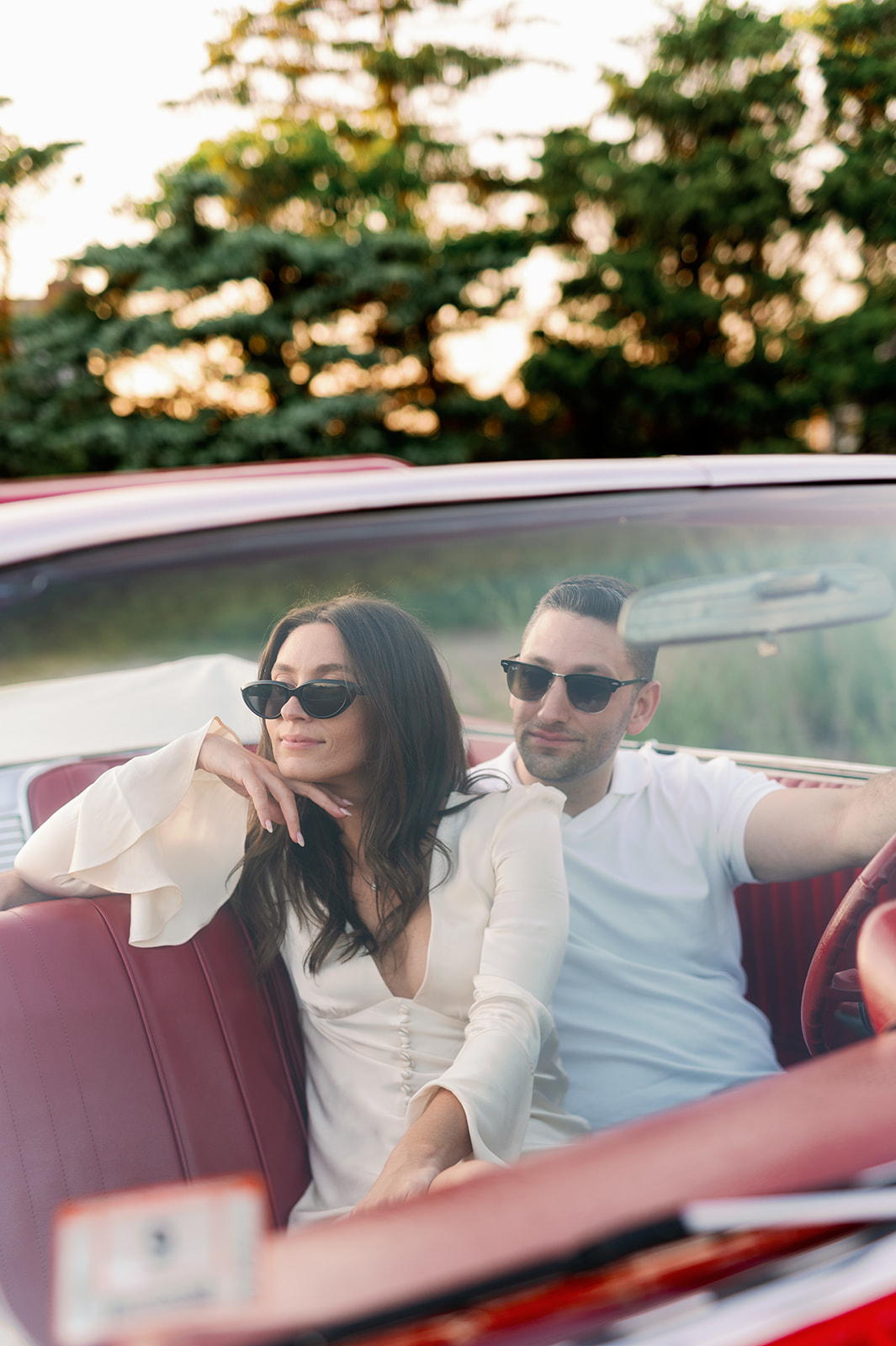 Bay Area non-traditional engagement photoshoot with a red vintage car.  